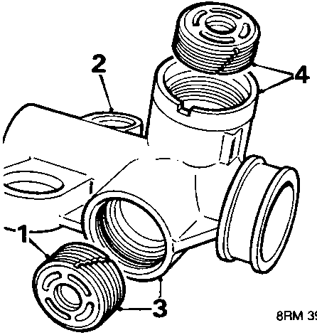 Pinion housing bracket held in a vice, showing yoke covers (parts 2 and 4) and housing (part 1), with part 3 at the base.