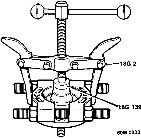Diagram showing bearing separator tool 18G 2 and thrust pad 18G 1390 clamped around a bearing inner track on a drive flange