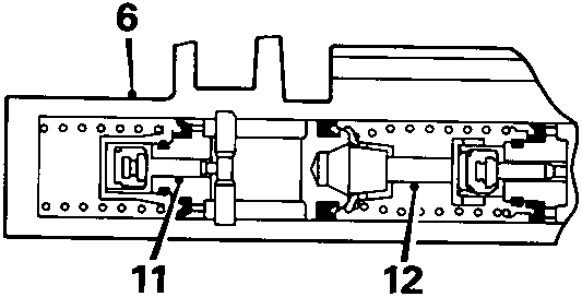 Cross-sectional diagram of a hydraulic valve unit showing internal components labeled 6, 11, and 12.