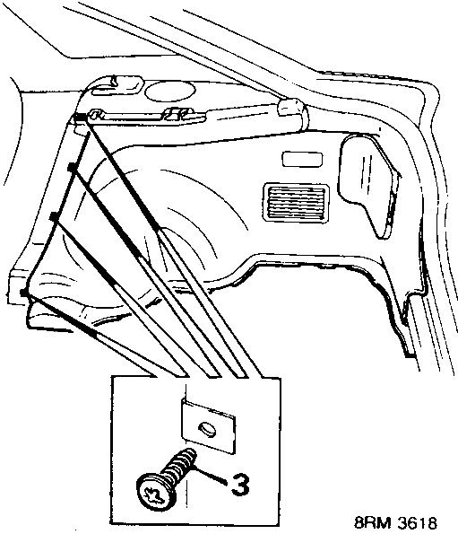 Diagram showing the lower trim casing area in the luggage compartment with a screw being removed from the carpet securing it to the body.
