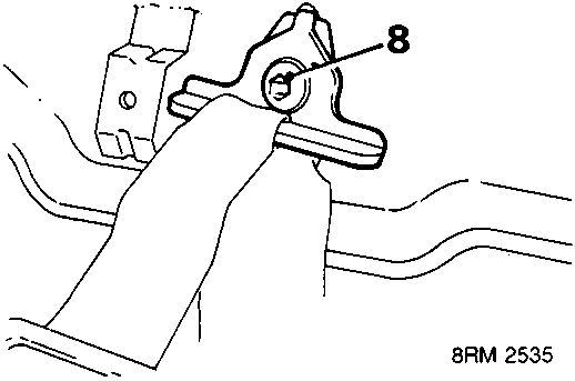 Diagram showing a hand removing a bolt from a buckle mounting bracket