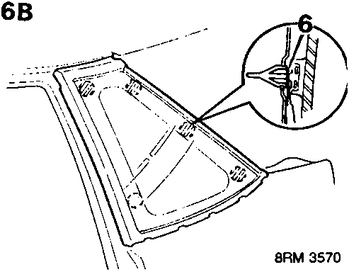 Illustrates removal of door panel trim using plastic pry tool