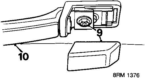Diagram showing removal of covers and screws securing grab handle