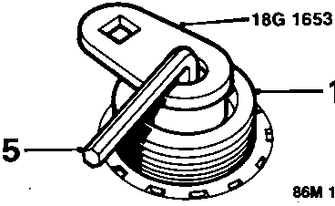 Diagram showing tool 18G 1653 restraining the alternator shaft (15) while removing the nut securing the pulley (16)