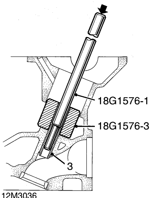 Valve guide – Support cylinder head face down on wooden blocks.