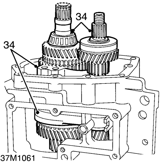 Noting position of roll pin in gearcase, remove reverse idler gear and shaft assembly.
